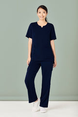 Navy women's scrub top with round neck, tailored fit, multiple pockets, and moisture-wicking fabric for healthcare professionals.