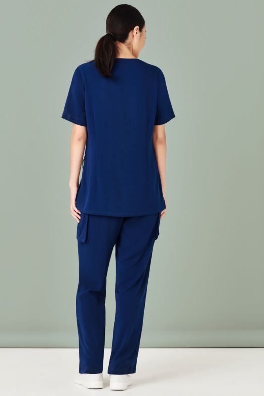 Stylish navy women's scrub top with round neck, tailored fit, multiple pockets, and wicking fabric for comfort in healthcare.