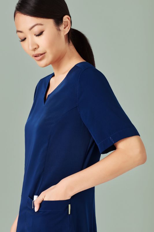 Women's Navy Avery Round Neck Scrub Top in Small, featuring a tailored fit, multiple pockets, and moisture-wicking fabric.