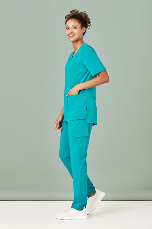 Women's Avery Round Neck Scrub Top in Charcoal, size XXS, featuring tailored fit, multiple pockets, and wicking fabric.