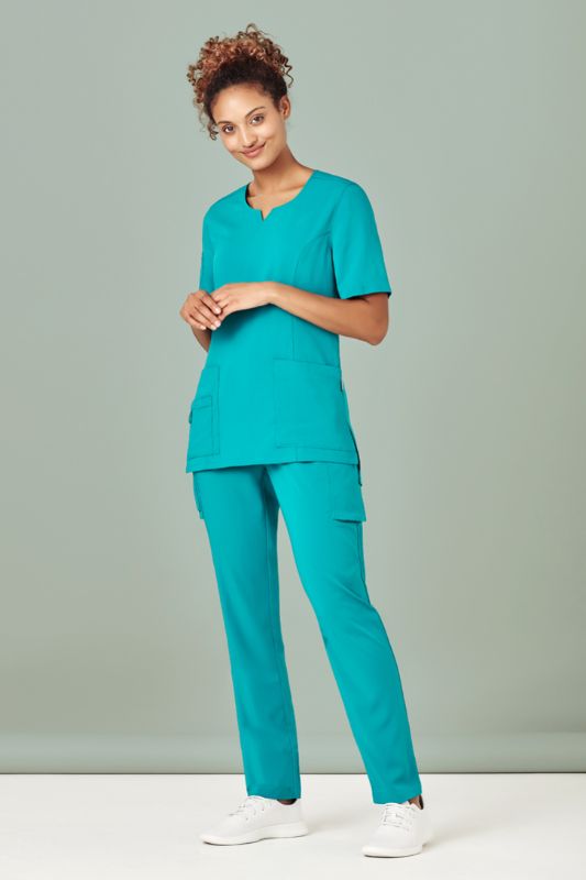 A women's charcoal scrub top with a round neck, fitted design, pockets, and wicking fabric for comfort in healthcare settings.