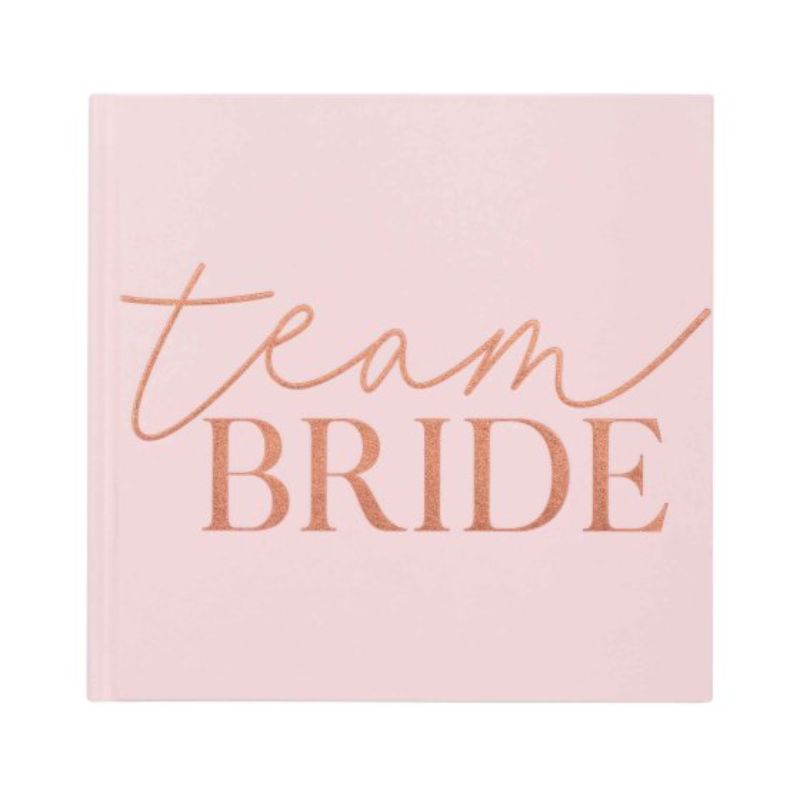 Blush velvet 'Team Bride' guest book for hen parties, featuring spacious pages for heartfelt messages and elegant design.