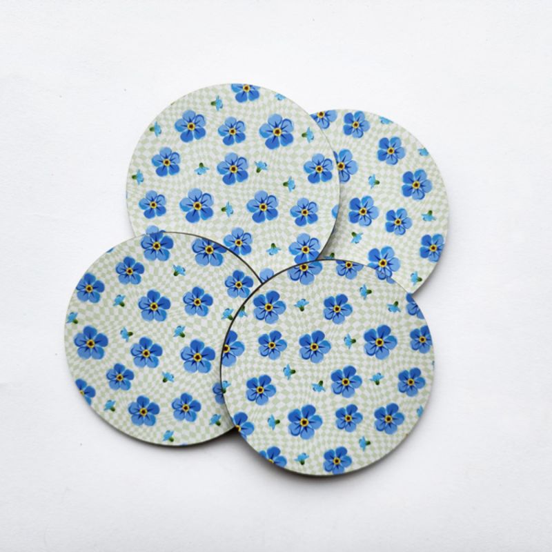 Vibrant 10cm Forget Me Not printed coaster with durable MDF and soft cork base, perfect for protecting your surfaces.