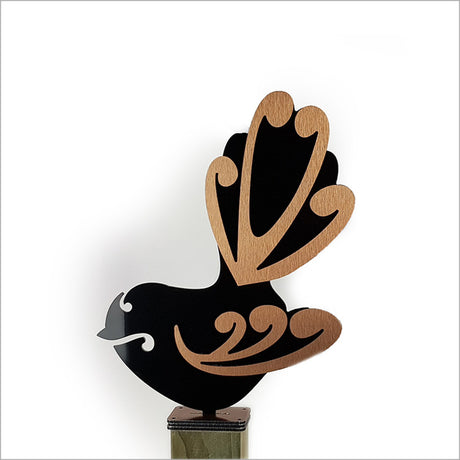 Whimsical freestanding Moko Fantail art in black and brushed copper, ideal for outdoor decor and bringing Kiwiana charm.