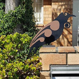 Freestanding 2 Tone Moko Tui art sculpture in black and brushed copper, perfect for enhancing gardens or outdoor spaces.