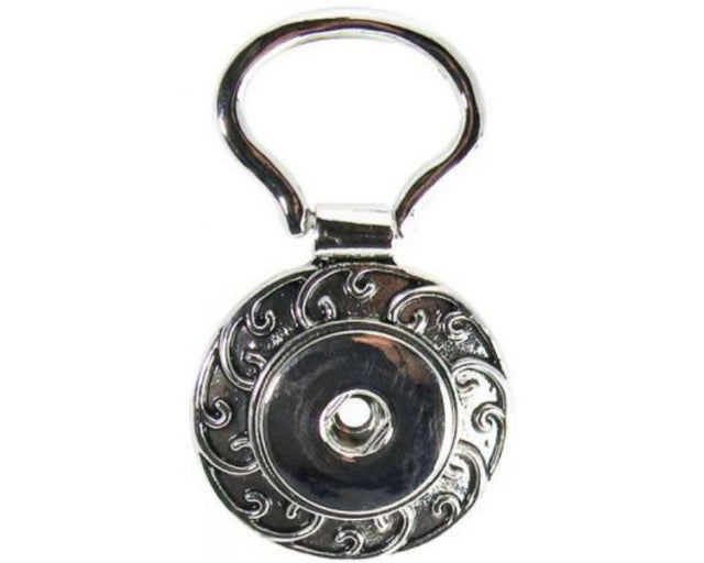 Vibrant Snaps REDFOX Key Ring Koru showcases a stylish Maori spiral design for key organization and personal flair.