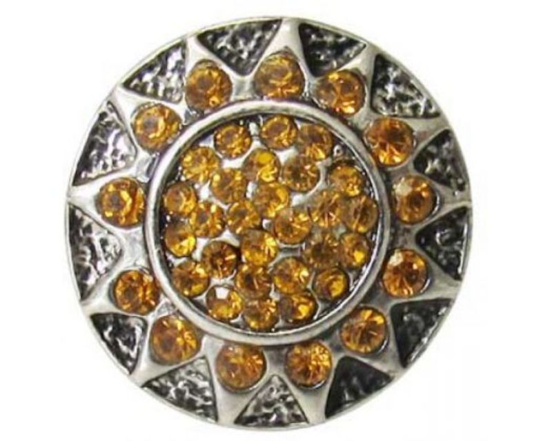 Intricate golden snap featuring Aztec sun design, perfect accessory for unique style and cultural appreciation.
