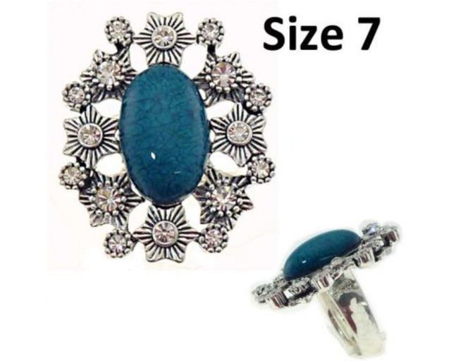 Teal resin center ring with diamantes, size 7, perfect for adding a touch of elegance to any outfit.