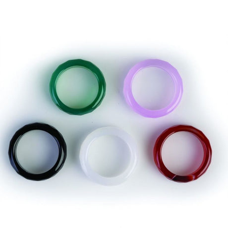 Colorful set of 100 faceted gemstone rings, featuring black obsidian, carnelian, aventurine, opalite, and rose quartz.