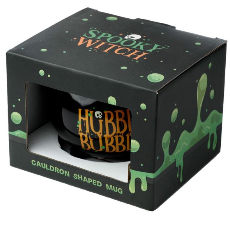 Whimsical black cauldron-shaped ceramic mug for hot drinks, perfect for cozy evenings and Halloween gatherings.
