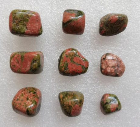 Loose tumbled stones in earthy tones, featuring Unakite and Blood Jasper, ideal for healing, crafting, and decor.