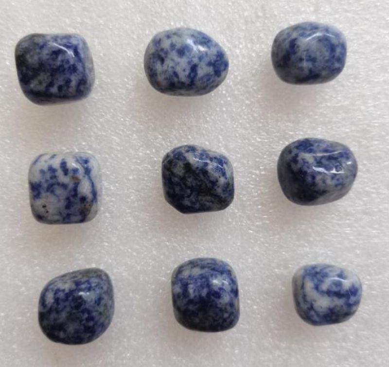 Loose tumbled Sodalite stones in a 0.5KG pack, featuring rich blue hues for meditation and creative decor.