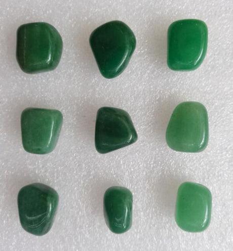 Loose tumbled aventurine stones in a 0.5KG pack, showcasing rich green hues for healing, crafting, and decor.