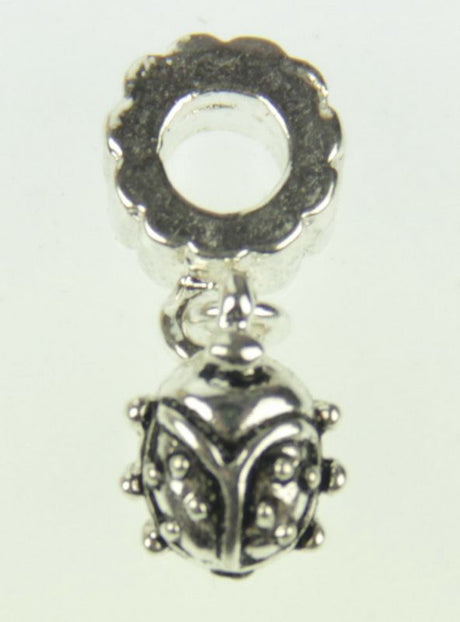 Set of five detailed metal ladybug charms, ideal for jewelry-making and crafting, symbolizing luck and creativity.