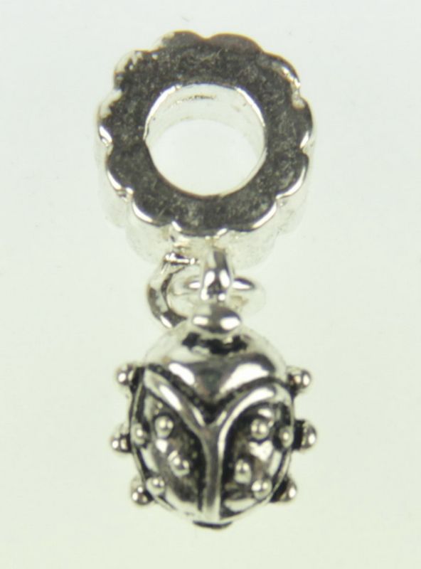 Set of five detailed metal ladybug charms, ideal for jewelry-making and crafting, symbolizing luck and creativity.