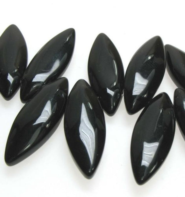 Set of 3 black glass long flat oval beads, 23x8mm, perfect for elegant jewelry crafting and DIY projects.