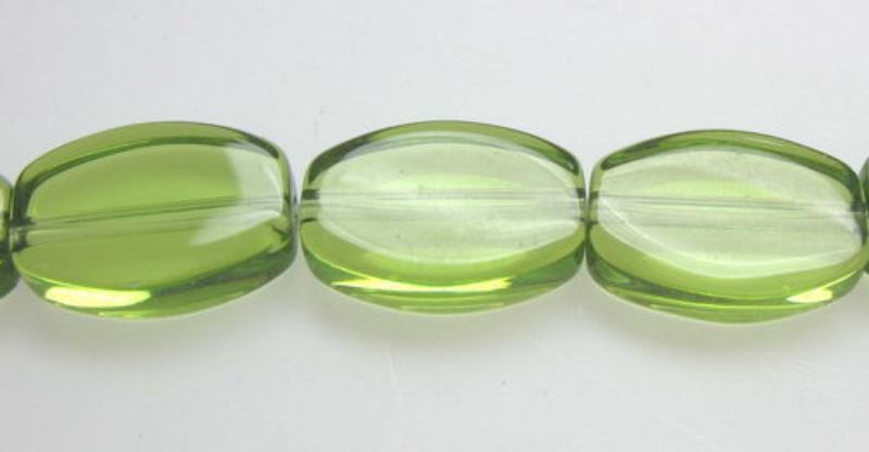 Bright green 11mm flat oval glass beads, 32 pieces per set, perfect for jewelry making and DIY crafts. Set of 2.