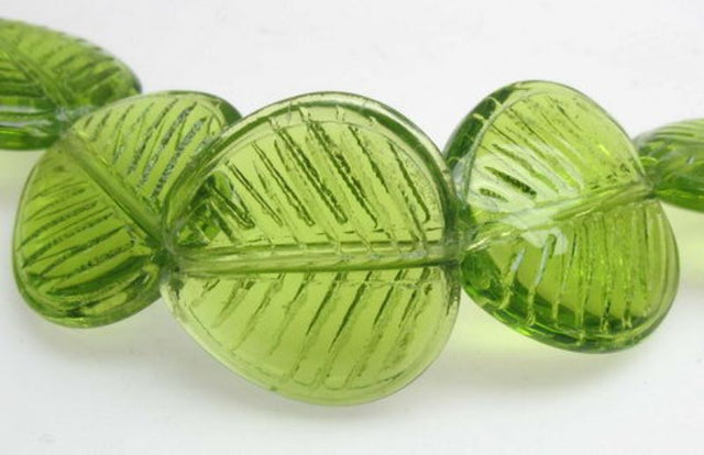 Clear leaf-shaped glass beads in green, 16x16mm, set of 22 for jewelry making and crafting, sparkling crystal finish.
