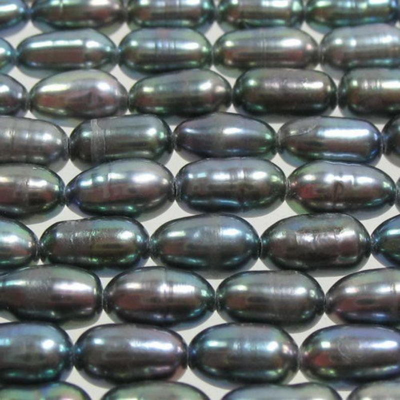 Set of 4 lustrous 5x3.5mm black freshwater pearls for elegant jewelry-making projects.