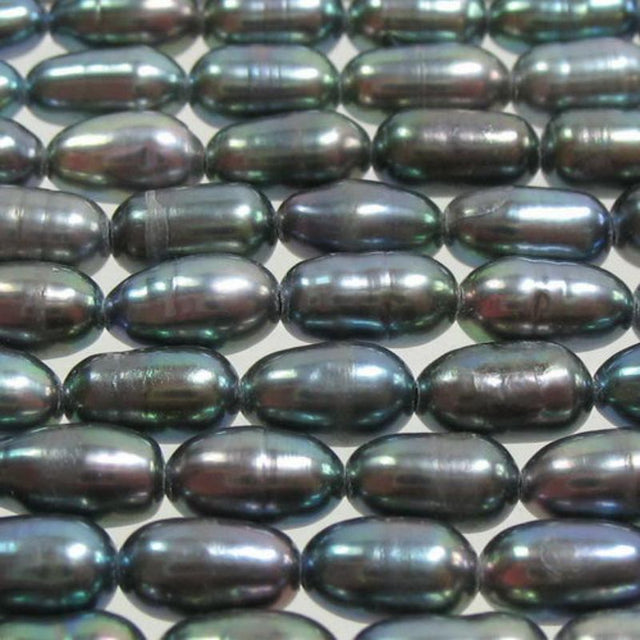 Set of 4 lustrous 5x3.5mm black freshwater pearls for elegant jewelry-making projects.