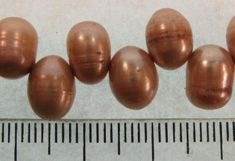 LT. BROWN Freshwater Pearl beads showcasing elegance and unique shapes, perfect for crafting necklaces and bracelets.