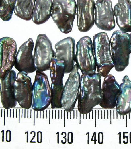Freshwater black pearl beads, pre-strung on cotton thread, perfect for elegant jewelry designs and crafting projects.