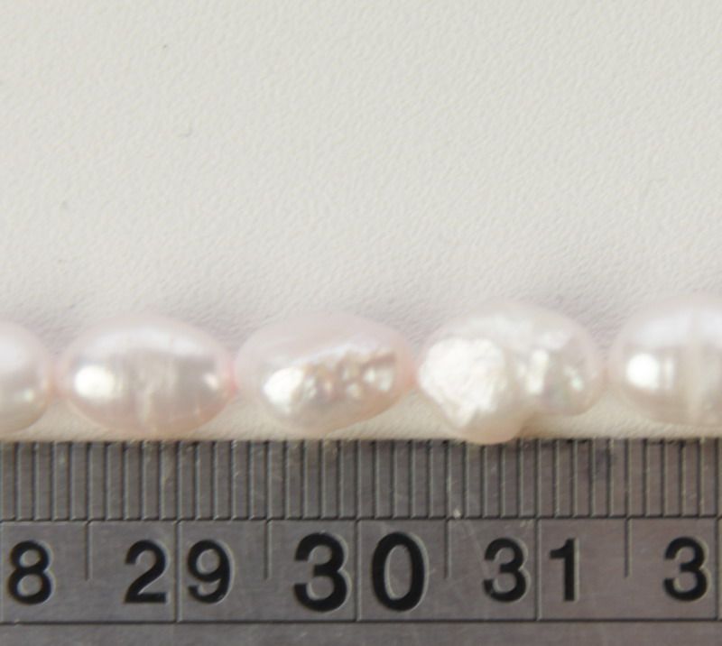 Set of 3 exquisite pink freshwater pearl beads, perfect for elegant DIY jewelry designs and special occasions.