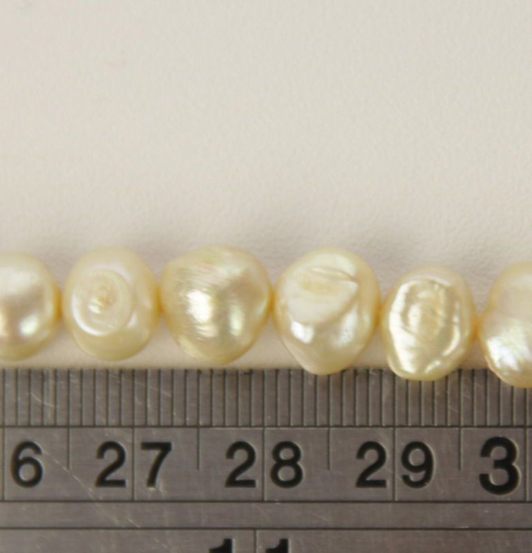 Set of 3 champagne freshwater pearls, perfect for elegant jewelry designs and versatile crafting projects.