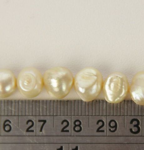 Set of 3 champagne freshwater pearls, perfect for elegant jewelry designs and versatile crafting projects.