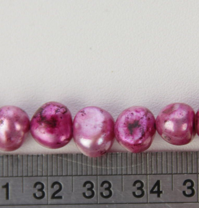 Set of 3 vibrant red freshwater pearls, perfect for jewelry making with exceptional luster and consistent shape.