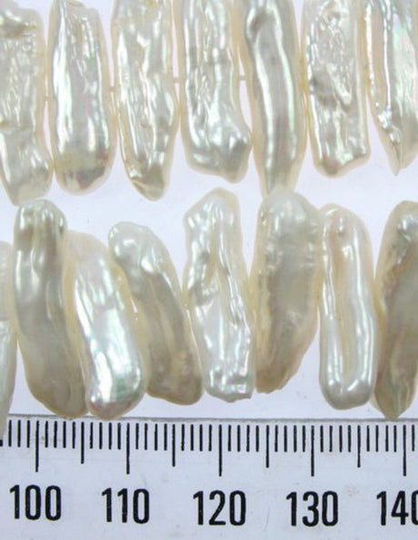 Cream Freshwater Pearls in soft hues, ideal for elegant jewelry designs and versatile crafting projects.