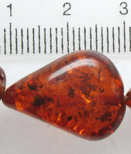 Amber resin beads, 19x11mm, pack of 23; perfect for jewelry making and DIY projects with a warm, elegant finish.