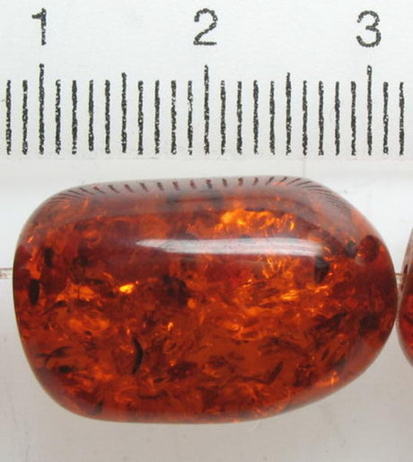 Amber resin beads in warm hues, 21x11mm, ideal for creating elegant jewelry; set of 18 pieces for creative designs.