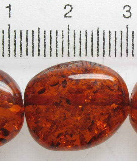 Amber resin beads, 16x15mm, 26pcs, showcasing a warm hue, ideal for jewelry and crafts, lightweight yet durable.