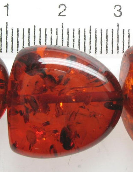 A pack of 21 vibrant amber resin beads, 18x18mm, perfect for jewelry-making and crafting elegant accessories.