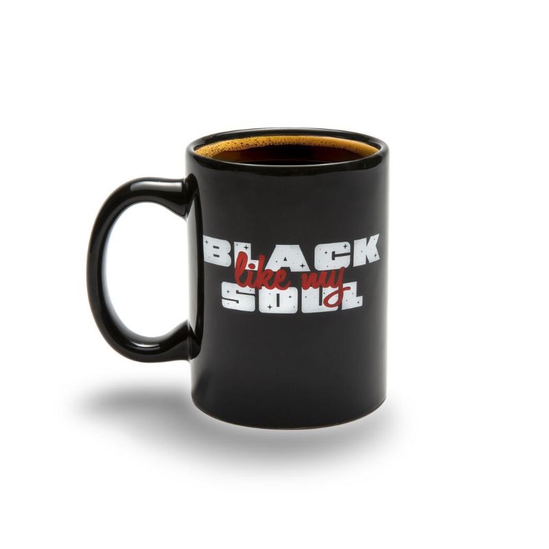 Elegant black ceramic mug with a unique design, perfect for coffee or tea lovers, microwave and dishwasher safe.
