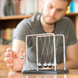 "Newton's Cradle - Funtime by Tobar Group, a stylish desk toy demonstrating momentum and energy principles with smooth pendulum motion."