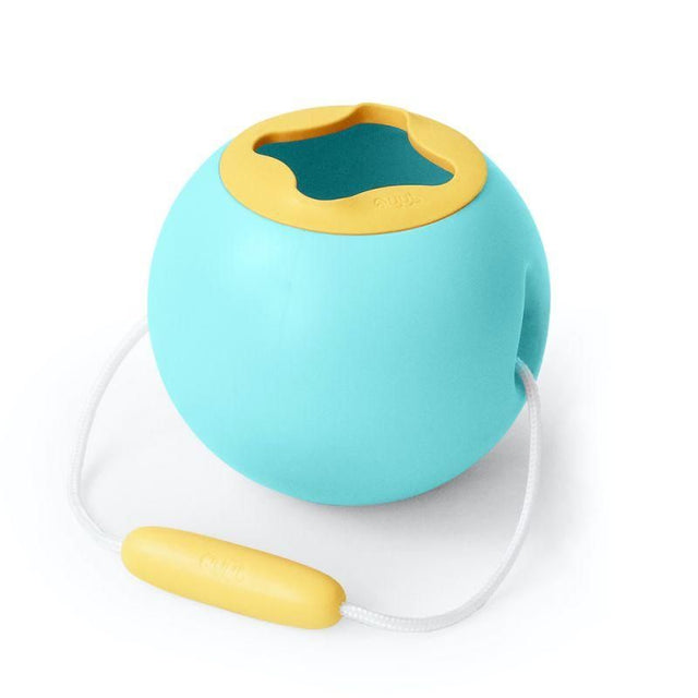 Mini Ballo Bucket in Banana Blue: a vibrant, spherical beach toy designed for toddlers to scoop and transport water effortlessly.