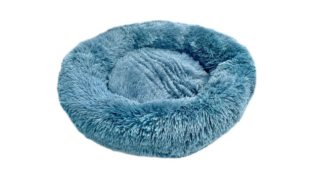 Calming blue ocean pet bed for small pets, offering plush comfort and stylish design to reduce anxiety and promote sleep.