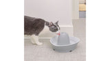 Ceramic pet fountain with 1.8L capacity, 360-degree design, whisper-quiet operation, promotes hydration for cats and small dogs.