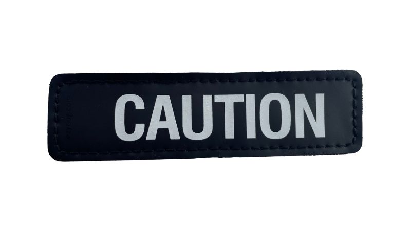 Stylish Side Patch - S CAUTION featuring a distinct caution motif, perfect for customizing jackets, bags, or hats.