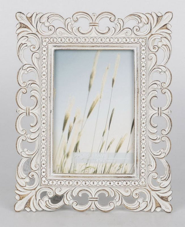 Natural wood photo frame for 4" x 6" photos, perfect for displaying cherished memories in elegant simplicity.