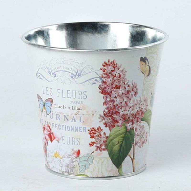 Elegant metal pot covers with floral design, perfect for enhancing and protecting 11CM plant pots; set of three.