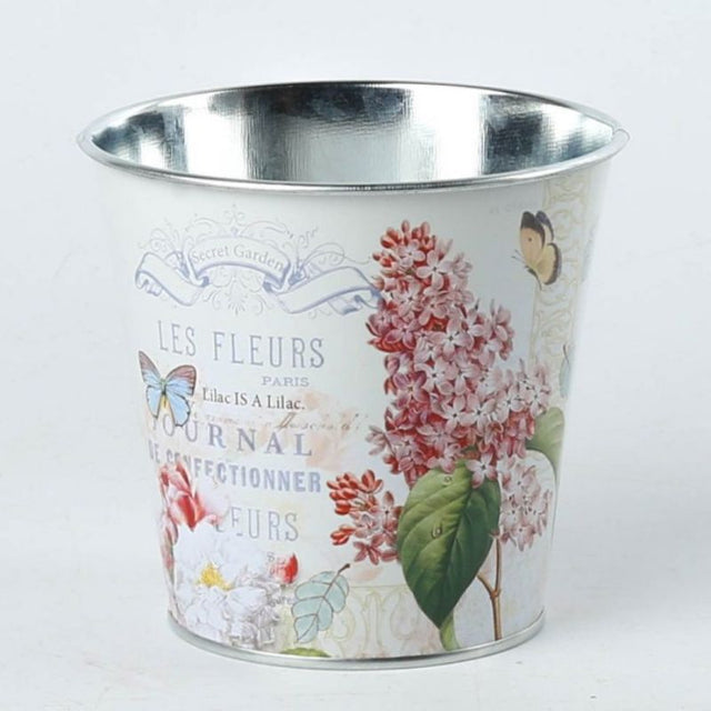 Elegant metal pot covers with floral design, perfect for enhancing and protecting 11CM plant pots; set of three.