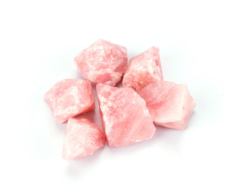 A box of 50 rough rose quartz gemstones, measuring 4-4.5 cm each, ideal for crafting, healing, and décor with a soft pink hue.