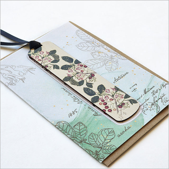 Exquisite greeting card featuring Sarah Featon's Puriri floral artwork and a bamboo bookmark with Puriri description.