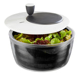 Sleek 3L salad spinner with stainless steel bowl, integrated pouring spout, and easy-crank mechanism for drying greens.