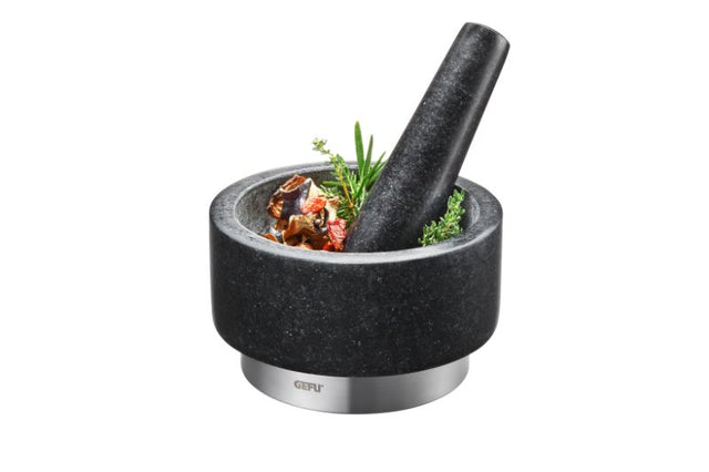 Heavy granite mortar with stainless steel ring, perfect for making pesto and spice blends; ergonomic design for ease of use.