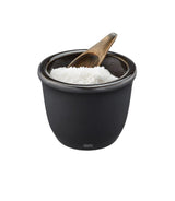 A stylish stoneware salt and spice pot with an airtight lid and wooden spoon, perfect for storing and serving seasonings.