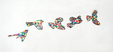 Geometric Flying Flock of Fantails Wall Art features stylized birds in vibrant colors, perfect for modern Kiwiana home decor.